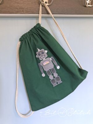 knapsack with robot machine embroidery applique design by A Bit of Stitch