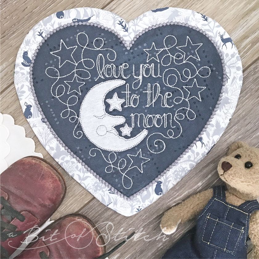 Love you to the moon heart shaped table topper doily Love Notes machine embroidery designs by A Bit of Stitch