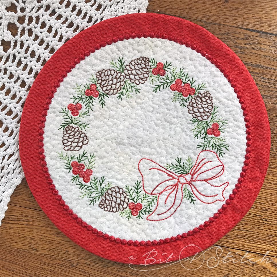 Holiday Pinecones embroidery designs on ITH mug rug coaster
