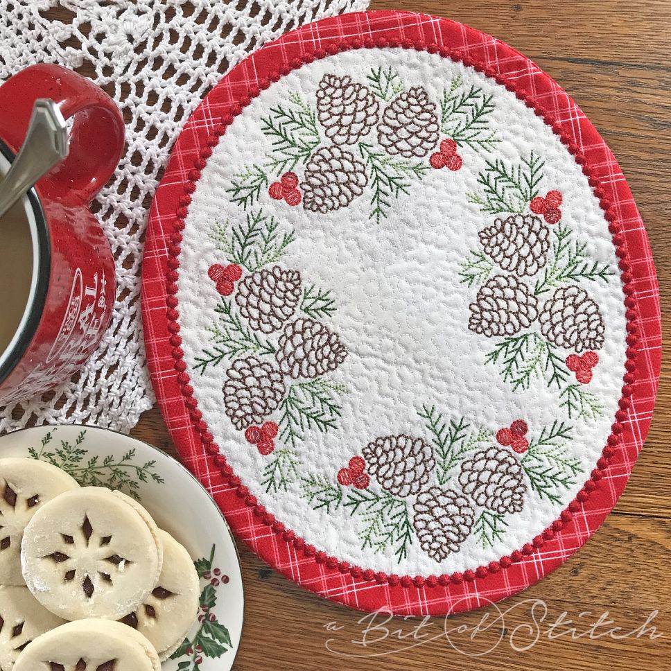Holiday Pinecones embroidery designs on ITH table topper mug rug