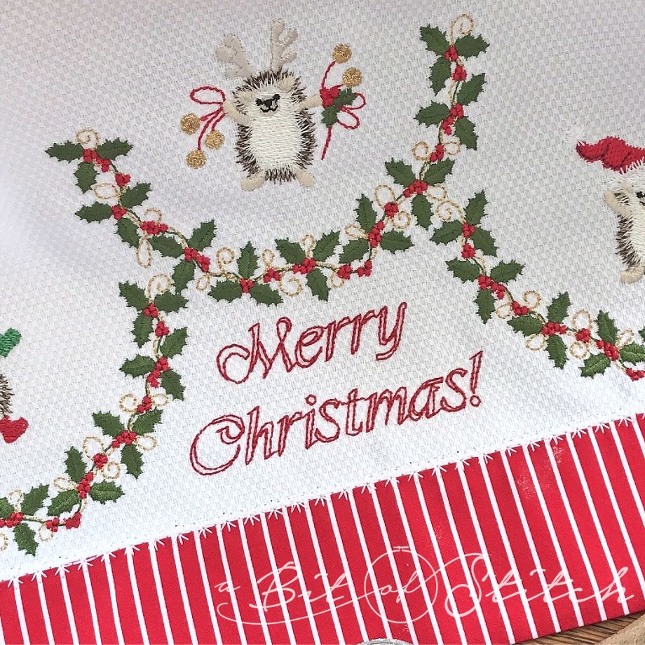 Merry Christmas bean stitch design, holly vine scallop border design, and Christmas hedgehog design by A Bit of Stitch