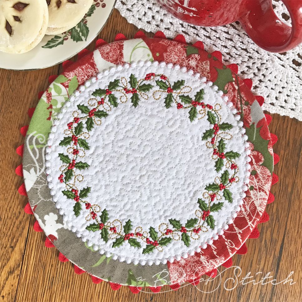 A Bit of Stitch embroidery designs Holly Vines circle wreath on Dainty Doilies Round.