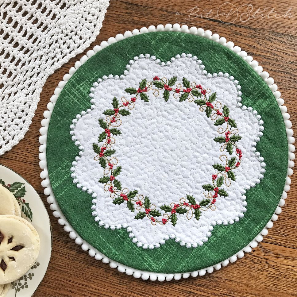 A Bit of Stitch embroidery designs Holly Vines circle frame wreath on Dainty Doilies Round