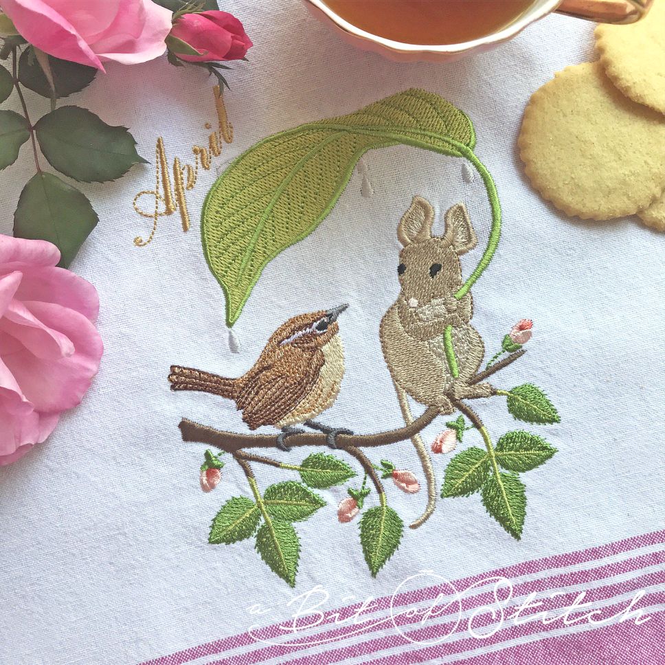 April Friends machine embroidery design by A Bit of Stitch - Carolina wren and mouse with leaf umbrella on rose branch