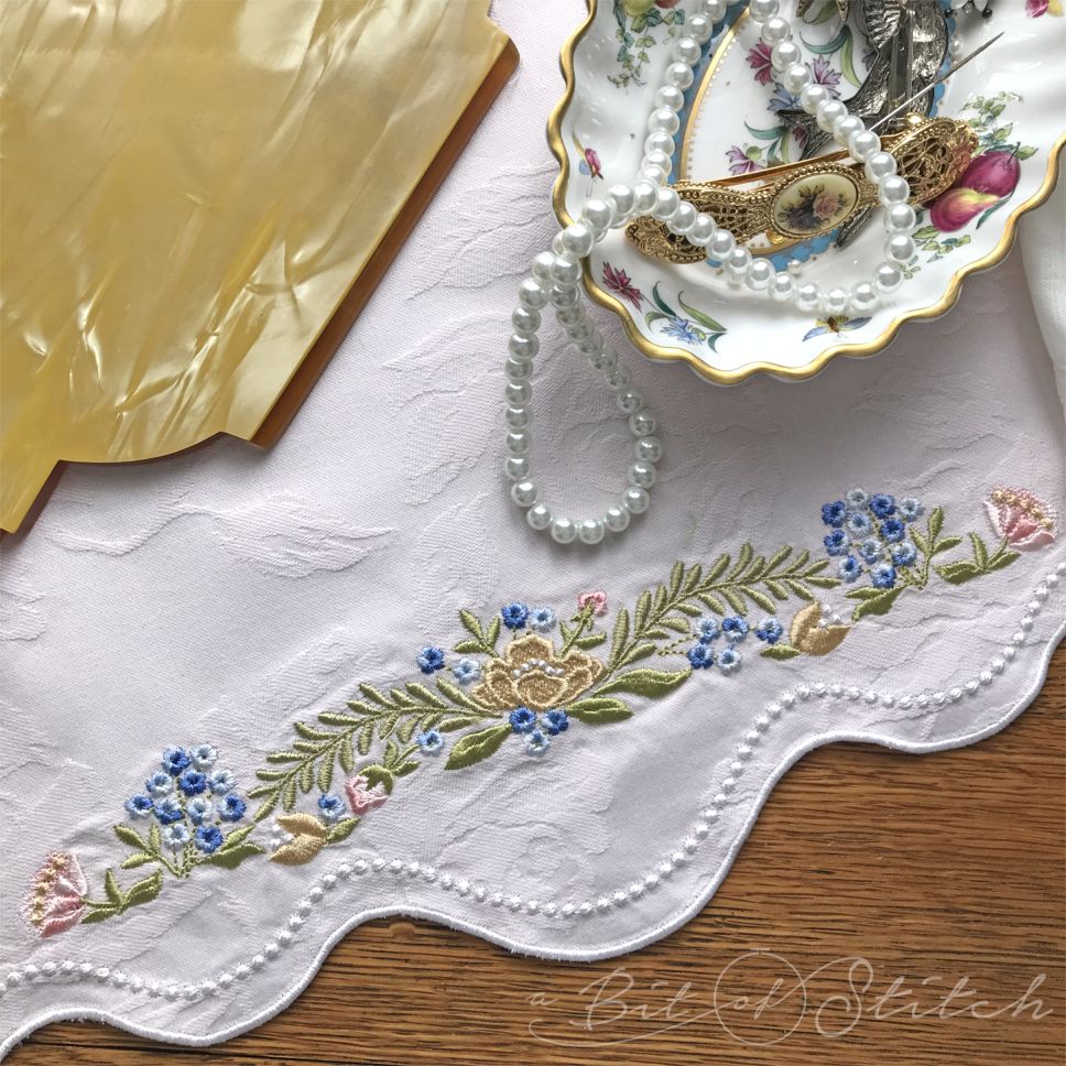 Fiori Eleganti machine embroidery designs by A Bit of Stitch - flower border on dresser linen