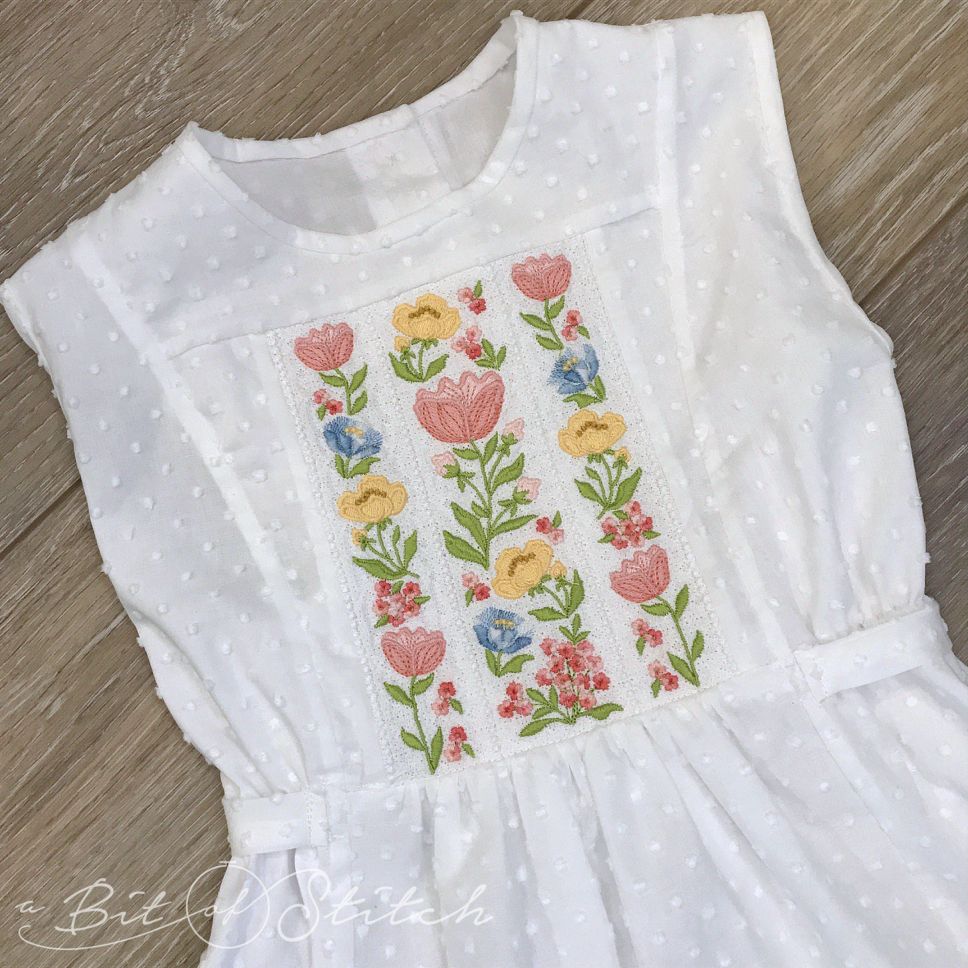 Fiori Eleganti machine embroidery designs by A Bit of Stitch - Spring and Summer flowers lace bodice on pinafore