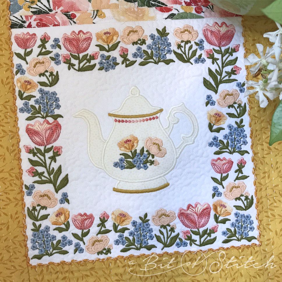 Fiori Eleganti machine embroidery designs by A Bit of Stitch - floral square frame around flowers teapot on table runner