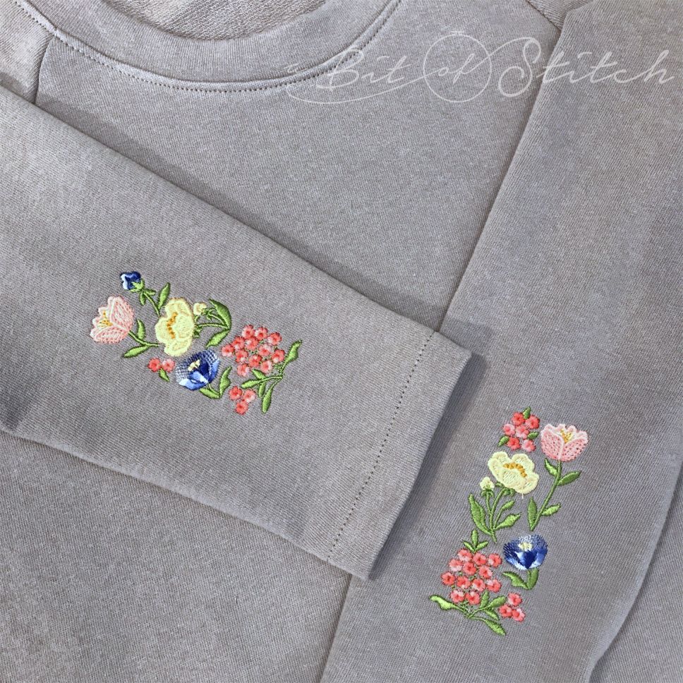 Fiori Eleganti machine embroidery designs by A Bit of Stitch - vintage Spring and Summer flowers on sweatshirt sleeves