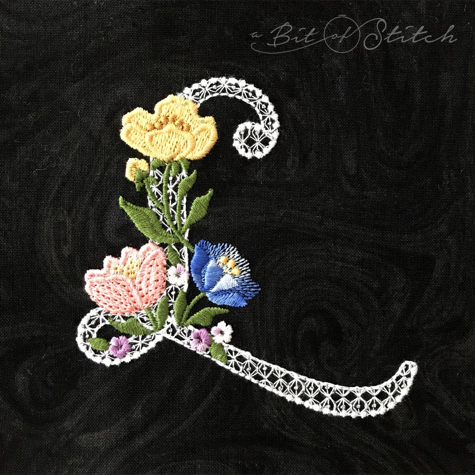 Fiori Script letter L monogram - elegant lacy floral script machine embroidery design by A Bit of Stitch
