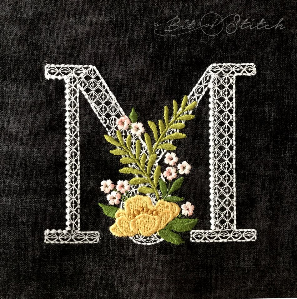 Fiori Script letter M monogram - elegant lacy floral script machine embroidery design by A Bit of Stitch