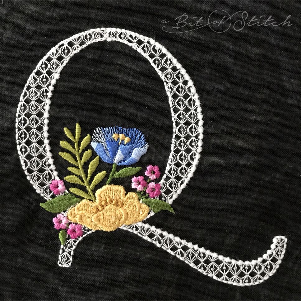 Fiori Script letter Q monogram - elegant lacy floral script machine embroidery design by A Bit of Stitch