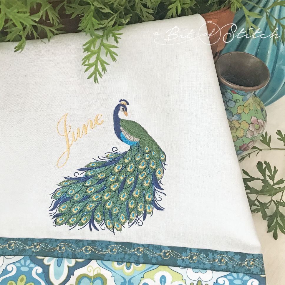 June Peacock machine embroidery design by A Bit of Stitch on tea towel
