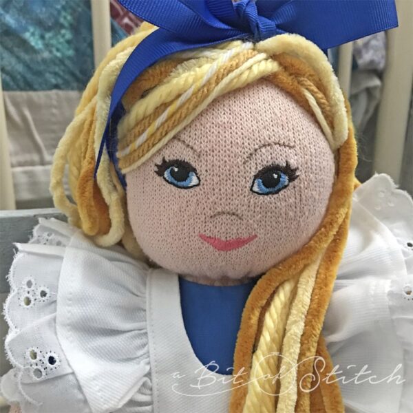 Alice in Wonderland style sock doll - machine embroidery face design by A Bit of Stitch