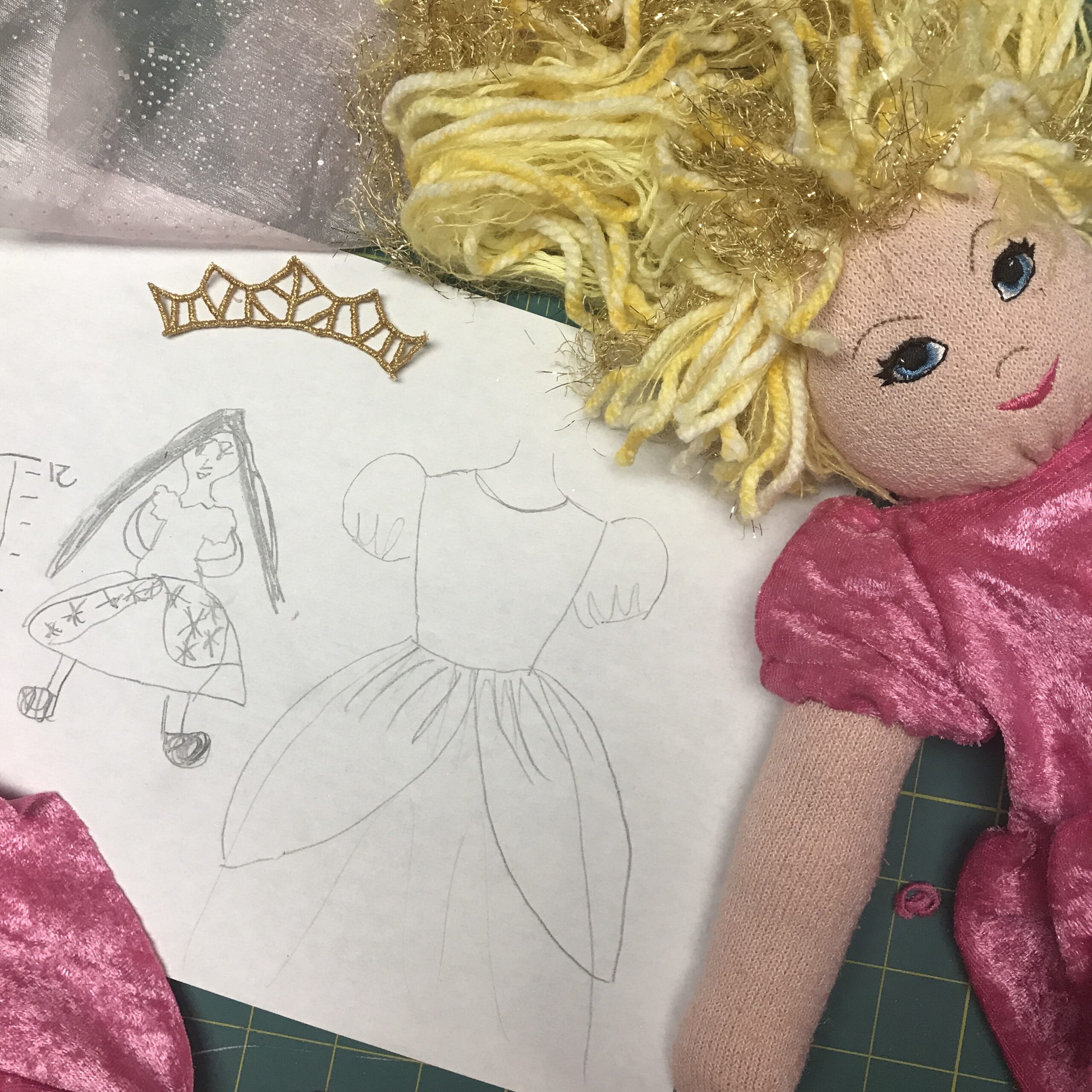Designing a sock doll princess dress - princess face and crown machine embroidery designs by A Bit of Stitch