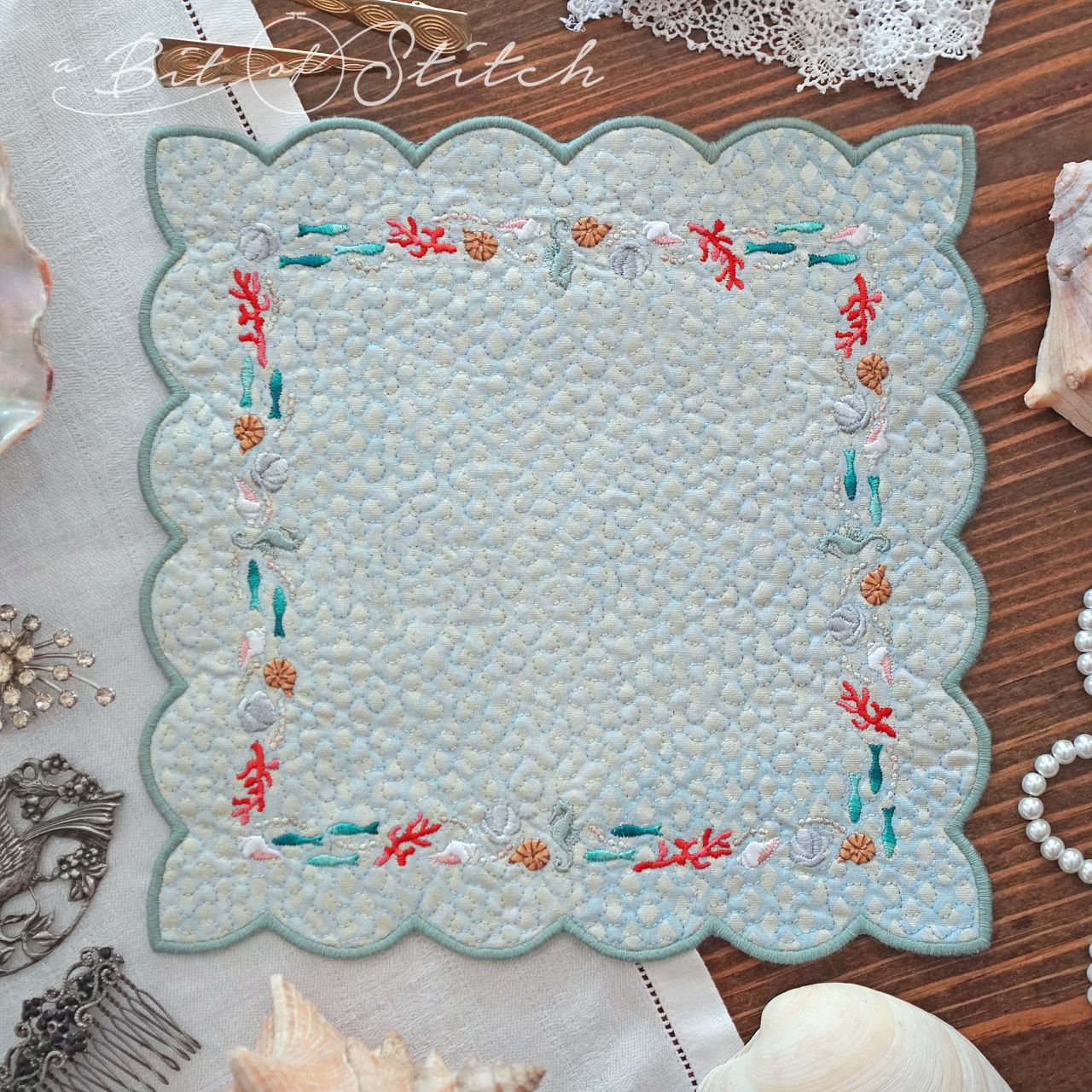 Sea ocean beach themed square frame embroidery design on made in the hoop square scallop edged doily - machine embroidery designs by A Bit of Stitch