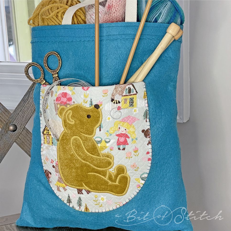 Made in the hoop quilted pocket with Winnie the Pooh applique - machine embroidery designs from A Bit of Stitch
