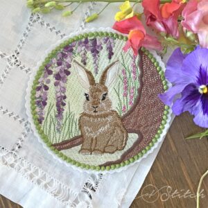 Cute bunny framed by woodland floral background - machine embroidery design from A Bit of Stitch