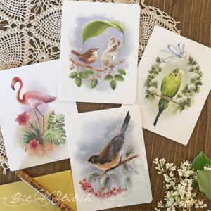 4.25" x 5.5" note cards from A Bit of Stitch featuring beautiful realistic bird illustrations - flamingo, robin, parakeet, and wren with field mouse friend