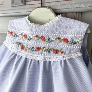 Elegant vintage style rose floral border designs on little girl dress bodice - Rosalina machine embroidery designs from A Bit of Stitch