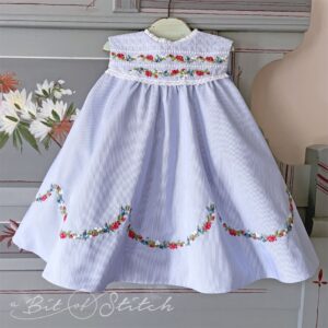 Elegant vintage style rose floral borders on little girl dress bodice and skirt - Rosalina machine embroidery designs from A Bit of Stitch