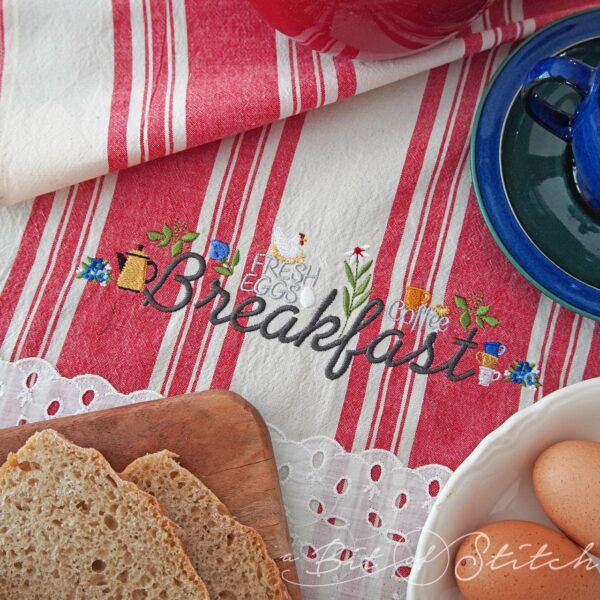 Breakfast machine embroidery design from A Bit of Stitch - breakfast lettering with chicken, eggs, coffee pot, teacups and flowers