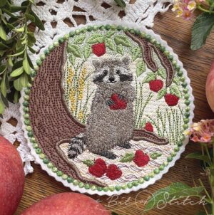 Adorable realistic raccoon and apple tree machine embroidery design from A Bit of Stitch