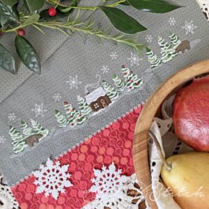 Winter Woods machine embroidery designs from A Bit of Stitch. Wintery woodsy snowy trees cabin and bears with snowflakes